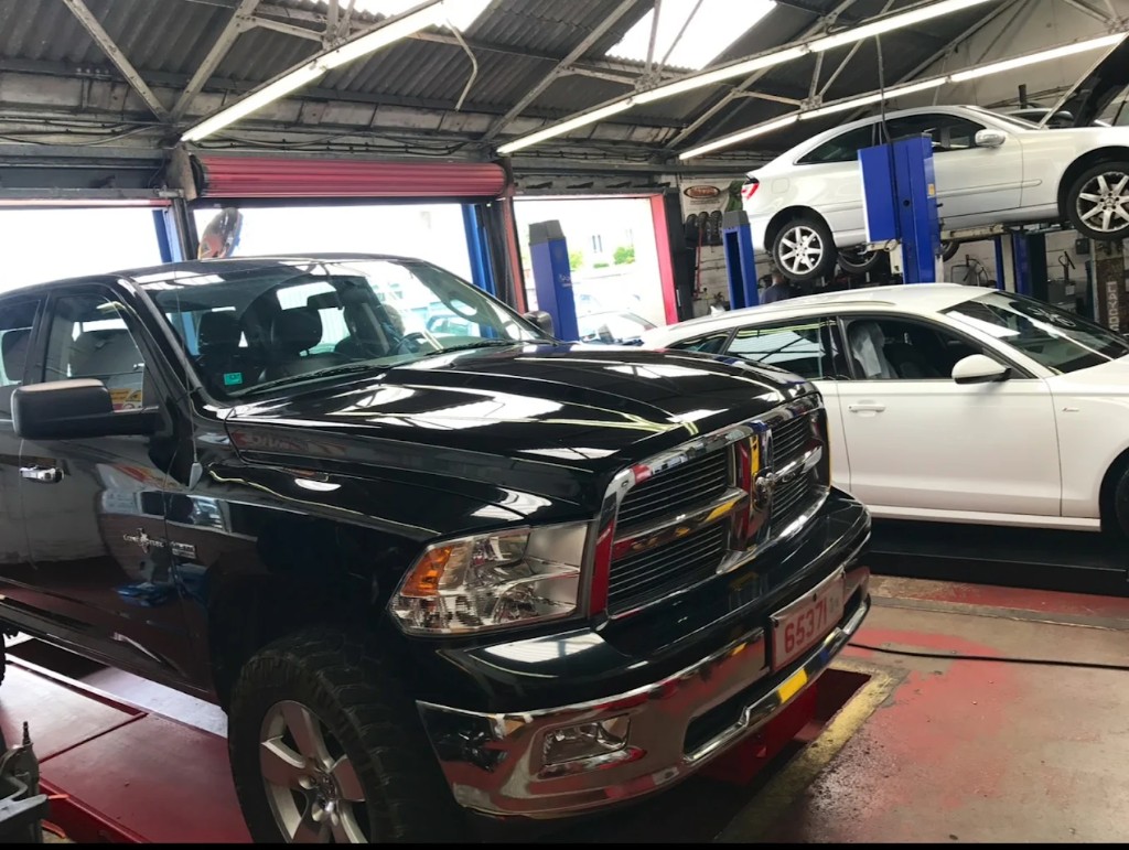 Workshop bays at Albion Service Centre with cars on the ramps